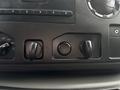 Close-up of the dashboard controls in a 2017 Ford Econoline featuring knobs for air distribution and a central button