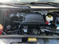 2017 Mercedes-Benz Sprinter engine with various components including an air intake system coolant reservoir and several hoses and wires visible