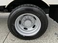 Close-up of a wheel from a 2007 Ford F-550 featuring a silver rim and Michelin tire with visible tread pattern