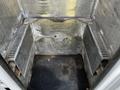 Interior of a 2018 Ford F-550 cargo area featuring metal walls and floor with ridges and cutouts for securing cargo