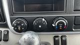 Dashboard controls of a 2018 Mitsubishi Fuso FE featuring climate controls and a gear shift knob