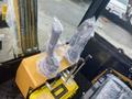 A close-up view of the control levers and joystick grips inside a 2024 AGT Industrial H13R Mini Excavator cabin