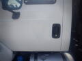 A 2016 International WorkStar 7500 truck with a white exterior featuring a door handle and a fuel tank visible beneath the driver's side