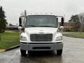 A white 2019 Freightliner M2 truck with a front grille and side mirrors facing forward
