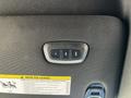 A control panel inside a 2022 RAM 3500 featuring buttons for seat adjustments and an airbag warning label