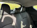 Interior of a 2021 Toyota C-HR showing the rear seats with black upholstery and headrests