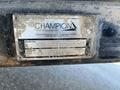 A metal nameplate attached to a trailer displaying the words "Champion Hoist and Equipment" and model information including "CS620T SOUTHLND" and serial number details