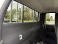 Interior view of a 2012 GMC Canyon showing the side window and the back seat area
