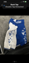 Blue and white Warrior MMA shorts featuring a bull graphic and decorative stitching on both legs