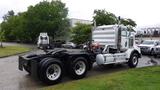 A 2019 Western Star Trucks 4900 with a silver and black color scheme featuring a large cab and dual tires at the rear