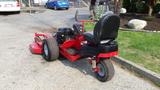 A red 2014 Ferris Mower ISX 800 featuring a black seat and a rear engine with two large rear wheels and a front cutting deck