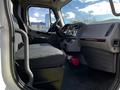 Interior view of a 2016 Freightliner M2 106 featuring a driver's seat dashboard and controls with a fire extinguisher visible on the floor near the seat