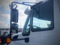 A 2016 International WorkStar 7500 truck with a prominent side mirror and clear windshield showcasing the vehicle's sturdy design