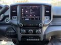 Interior dashboard of a 2022 RAM 5500 showing a large touchscreen display with radio controls and climate settings