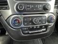 A close-up view of the climate control panel in a 2016 Chevrolet Tahoe featuring buttons for temperature and air conditioning settings