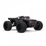 A black Arrma 1/5 Outcast 8S EXB AVC 4X4 RTR Brushless Stunt Truck with large tires and aggressive styling featuring red accents and a detailed grill design