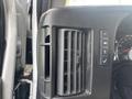 Image shows the interior of a 2018 Chevrolet Express focusing on the dashboard air vent and nearby control buttons for features like headlights and parking assist