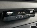 Control panel of a 2019 Mercedes-Benz Sprinter featuring buttons for air conditioning settings and temperature display