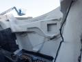 Interior view of a 2014 International Durastar's cabin showing the dashboard frame and wiring without any controls or instruments visible