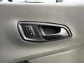 Close-up of the interior door handle of a 2023 Ford Transit featuring buttons for locking and unlocking the door