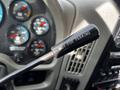 A gear shift lever with the inscription NOT FOR PARKING prominently displayed