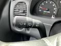 Close-up of the turn signal and windshield wiper control lever in a 2010 Ford Ranger interior