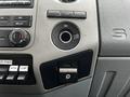 Interior dashboard of a 2014 Ford F-550 with controls for air conditioning and audio system featuring a USB port and a 12-volt power outlet