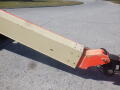 A 2008 JLG Boom Lift with a long extending arm in a beige and orange color scheme featuring a pivot joint for maneuverability