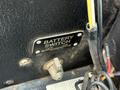 A battery switch plate labeled "BATTERY SWITCH" with "OFF" and "ON" indicators and attached wires in a black textured enclosure