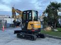 A 2023 Sany SY35U mini excavator with a yellow and black exterior features a cabin with glass panels and tracks for mobility