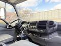 Interior view of a 2014 Hino 195 truck showing the driver's seat steering wheel and dashboard controls