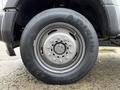Close-up of a tire mounted on a 2017 Ford F-450 Super Duty featuring a silver rim and black tread with the brand name visible on the sidewall