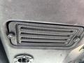 Close-up of a ventilation grille in a Toro Groundsmaster 5910 showing horizontal slats and screws on the edges