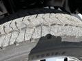 Close-up of the tread of a 2016 Ford F-550 tire showing worn rubber with visible grooves and patterns