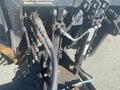 Close-up of hydraulic components on a 2010 Trackless MT6 showing various hoses and connectors used for operation