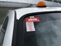 A 2011 Ford F-550 with a sticker displaying a certificate of approval for various months such as January February March April May and June