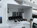 Control panel of a 2005 Freightliner M2 106 featuring several levers and buttons for operating boom functions