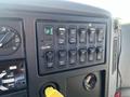 The control panel of a 2007 International 7300 featuring various switches and buttons for vehicle functions including lights and heating
