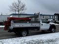 2008 Ford F-450 SD truck with a flatbed and a mounted equipment/tool attachment on the rear