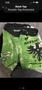 Green MMA shorts with a black eagle design and the word "Affliction" prominently displayed on the front