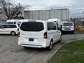 A white 2018 Mercedes-Benz Metris van parked with its rear facing the viewer, showcasing its sleek design and distinctive rear lights