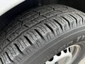 Close-up of a tire on a 2016 Mercedes-Benz Sprinter showcasing a textured tread and sidewall branding