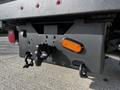 A 2018 Ford F-550's rear hitch and lighting setup showing the tow hitch and an orange reflector light