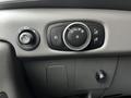 Control panel of a 2021 Ford Transit featuring knobs for headlights fog lights and dashboard brightness