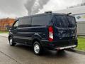 A 2020 Ford Transit van in dark blue color with a high roof and rear barn doors parked on a surface with no visible people or obstacles around