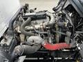 The image shows a 2018 Hino 195 engine with visible hoses and components including an air intake and various pipes connected to the engine block