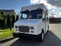 A 2017 Freightliner M Line white food truck with a boxy shape large front windshield and prominent grille