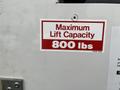 A sign on a vehicle door indicating the maximum lift capacity of 800 lbs