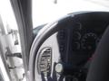 The interior dashboard of a 2005 Freightliner M2 106 Medium Duty featuring various gauges buttons and controls