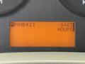 A digital display showing the numbers PRN 0421 and 6663 hours on an orange background